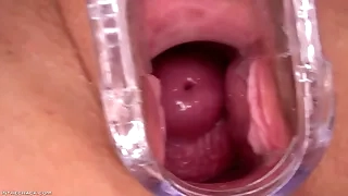 A pretty woman plays with her pussy with a toy in her eyes