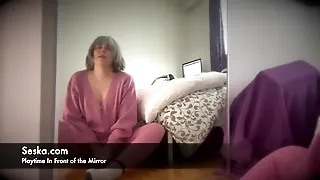 Seska is playing and teasing in front of the mirror